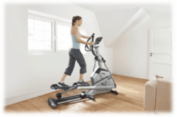 A woman on elliptical machine