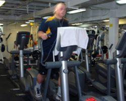 Male Doing Exercise in Elliptical Machine